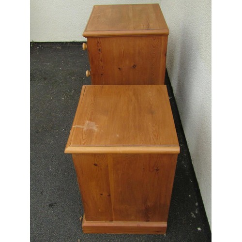 1555 - A pair of pale pine three drawer bedside chests, 67cm high, 50 x 46cm, together with a similar four ... 