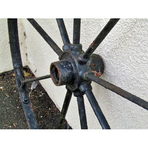 1564 - A large pair of antique wrought iron coach wheels, 135cm diameter (2)