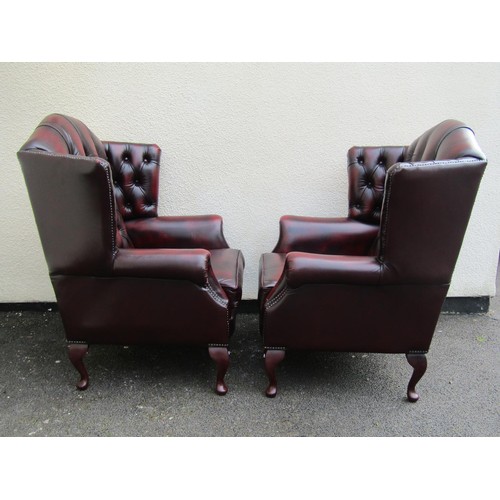 1567A - A pair of Thomas Lloyd wing elbow chairs, in the George III style (2)