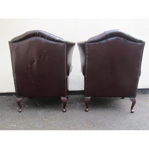 1567A - A pair of Thomas Lloyd wing elbow chairs, in the George III style (2)