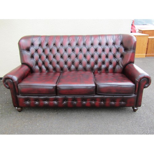 1568 - A Thomas Lloyd sofa high-backed club three seat sofa