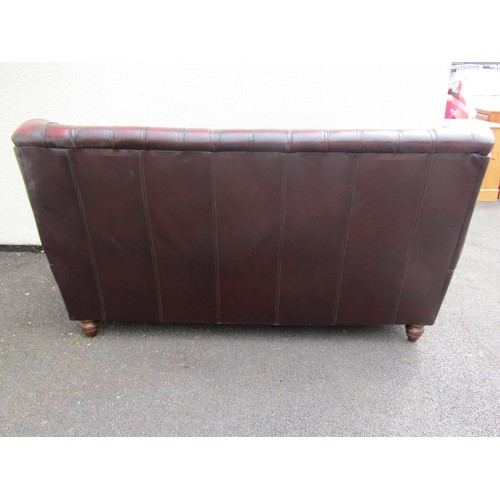 1568 - A Thomas Lloyd sofa high-backed club three seat sofa