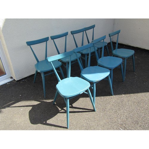 1569 - A set of seven over-painted kitchen chairs in the Ercol style