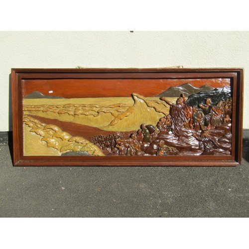 1572 - A carved lacquered hardwood narrative panel, depicting Moses parting the Red Sea, 67 x 155cm.