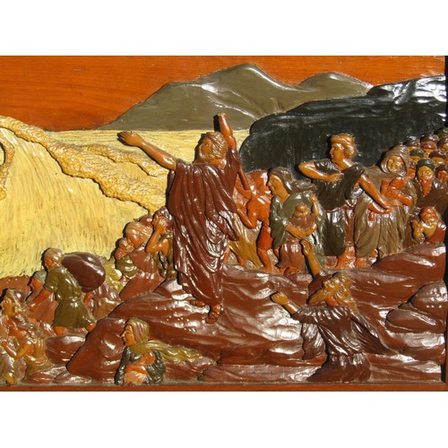 1572 - A carved lacquered hardwood narrative panel, depicting Moses parting the Red Sea, 67 x 155cm.