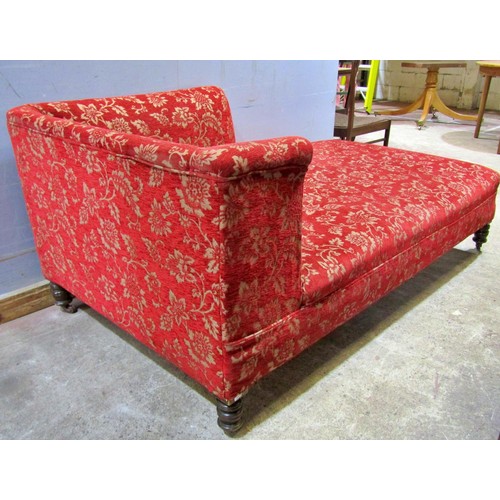 1582 - A large upholstered day bed / chaise lounge, in red floral and foliate covers, 77cm high, 191 x 100c... 