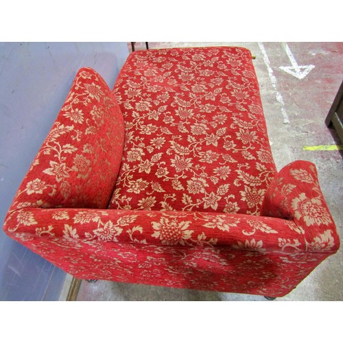 1582 - A large upholstered day bed / chaise lounge, in red floral and foliate covers, 77cm high, 191 x 100c... 