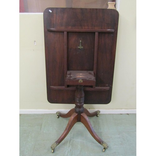 1584 - A 19th century mahogany supper table with rectangular top on turned pillar and tripod base, on embos... 