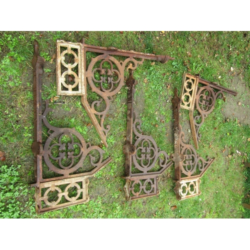 1033 - Architectural salvage - a set of four Victorian cast iron brackets with pierced gothic tracery detai... 