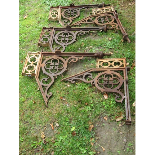 1033 - Architectural salvage - a set of four Victorian cast iron brackets with pierced gothic tracery detai... 