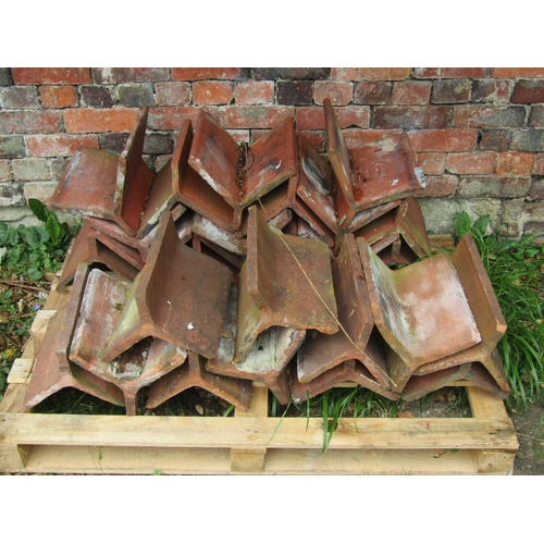 1034 - 27 reclaimed terracotta roof ridge tiles, slight variation in design, some stamped