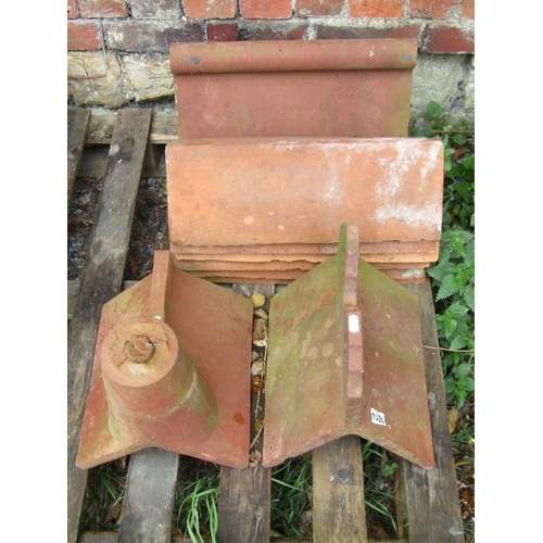 1035 - Architectural salvage - a small collection of reclaimed terracotta ridge tiles of varying design, so... 