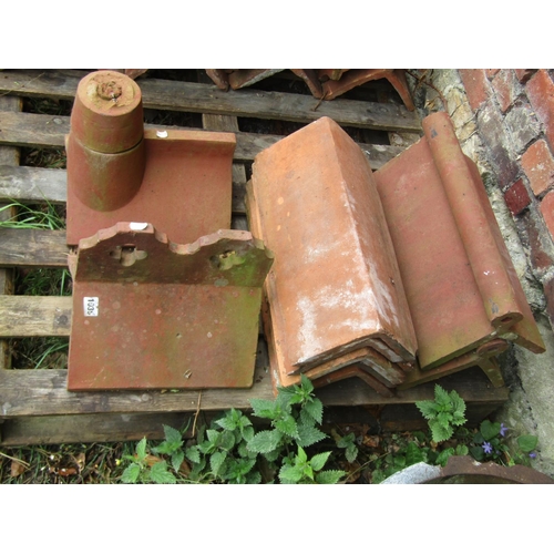 1035 - Architectural salvage - a small collection of reclaimed terracotta ridge tiles of varying design, so... 