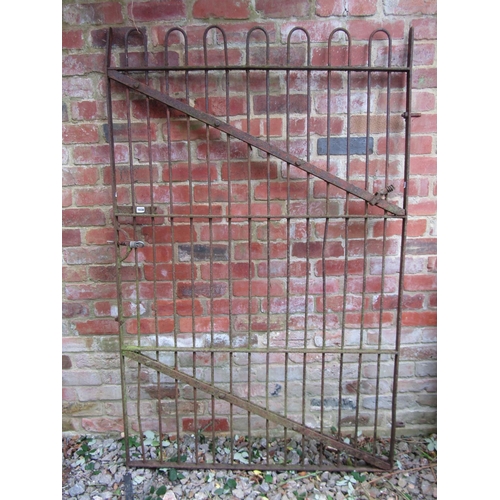 1038 - An antique wrought iron gate with simple open vertical hooped bars, 181 cm high x 116 wide