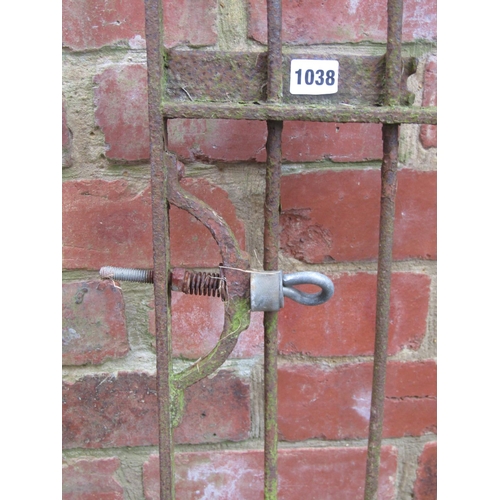 1038 - An antique wrought iron gate with simple open vertical hooped bars, 181 cm high x 116 wide