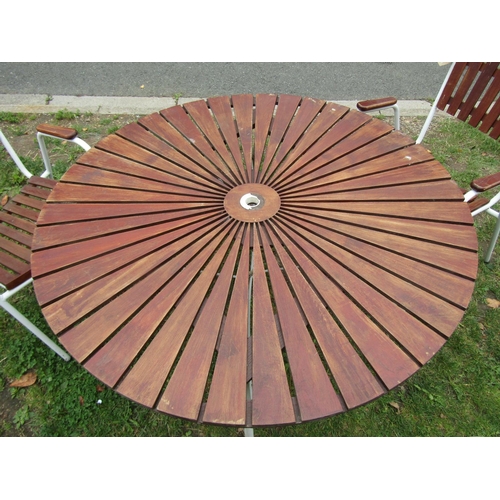 1045 - A vintage five piece garden terrace suite comprising table of circular form with radiating teak top ... 