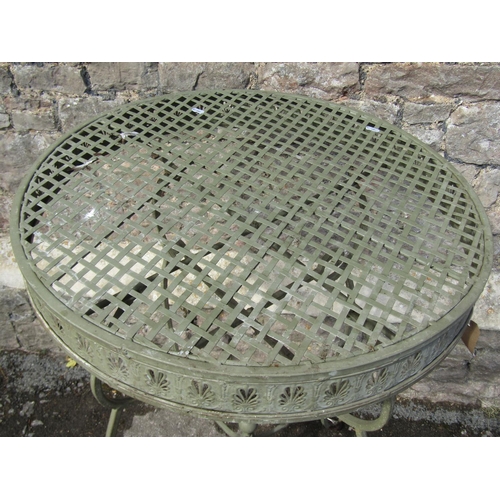 1081 - A decorative sage green painted cast metal garden table, the circular lattice panelled top with pier... 