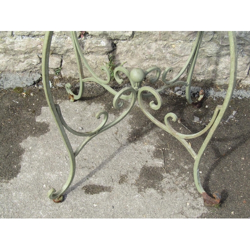 1081 - A decorative sage green painted cast metal garden table, the circular lattice panelled top with pier... 