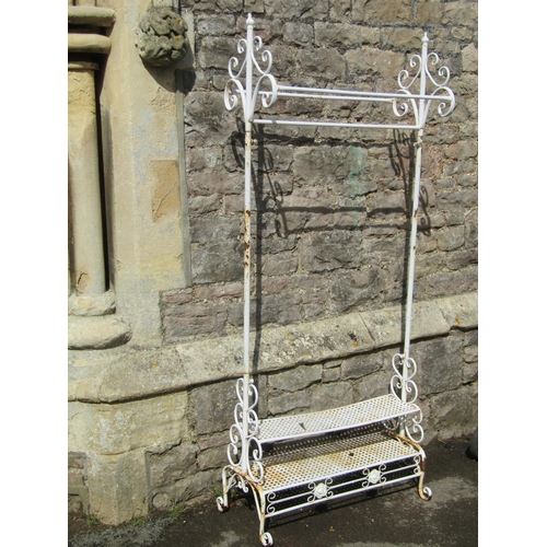 1082 - A decorative painted light metal stand with simple open scroll detail, together with a further but h... 