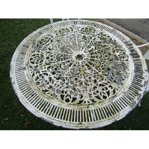 1083 - A painted and weathered cast aluminium garden terrace table with radiating decorative circular pierc... 