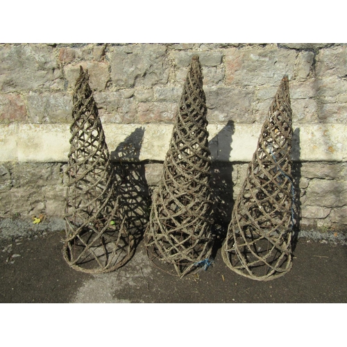 1110 - Four weathered woven wicker and iron wire work garden obelisks of pointed conical form, each 79cm hi... 