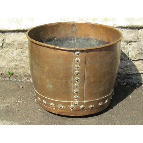 1113 - A large antique riveted copper hopper / cauldron, 42cm high, 54cm diameter.