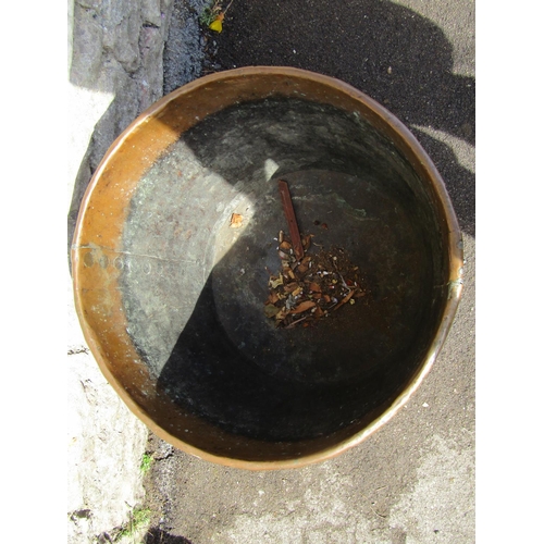 1113 - A large antique riveted copper hopper / cauldron, 42cm high, 54cm diameter.