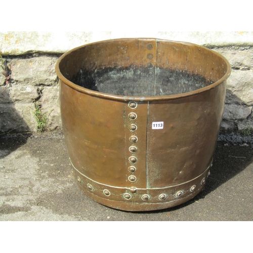 1113 - A large antique riveted copper hopper / cauldron, 42cm high, 54cm diameter.