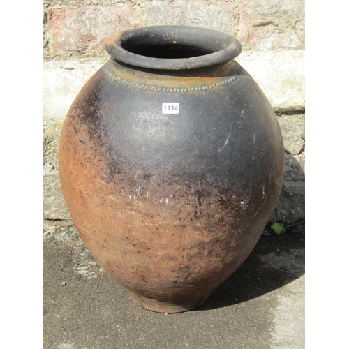 1114 - A large burnished terracotta vase / planter of baluster form with pinched collar, 65cm high.