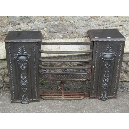 1128 - A Regency iron fire grate, with foliate and floral moulded detail, 61cm high, 97 x 27cm.