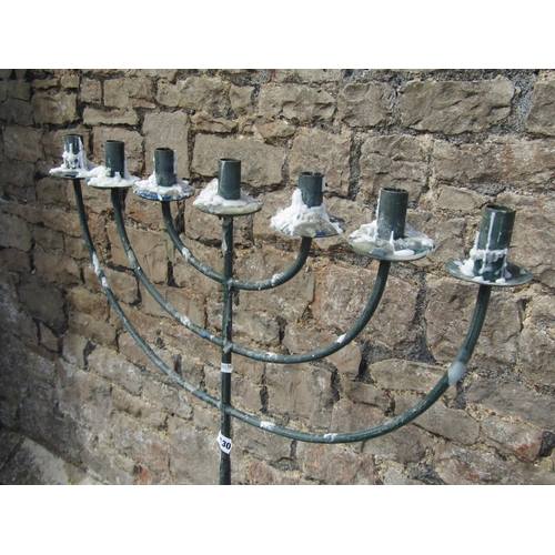 1130 - A tall floor-standing candelabra / menorah, raised on four supports with pinched feet, 151cm high, 6... 