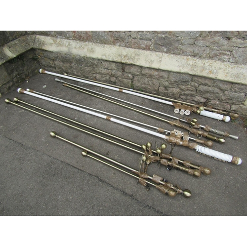 1135 - A group of curtain poles and fittings, painted and brass, examples.