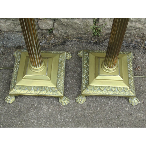 1146 - A pair of Edwardian brass standard lamps in the form of fluted columns with Corinthian capitals, rai... 