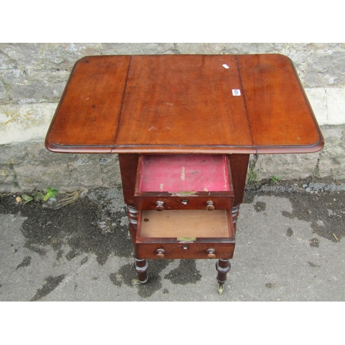 1220 - A Victorian mahogany sewing table with drop sides over two drawers and two false drawers, slide out ... 