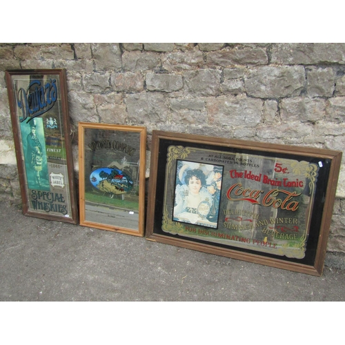 1419 - Three vintage advertising wall mirrors, ‘Dewar’s Scotch Whisky’, Southern Comfort and the largest ‘T... 