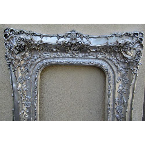 1589 - A large reproduction gilt overmantel mirror frame, 170 x 102cm, together with a further large reprod... 