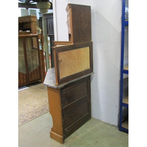 1151 - A early 20th century oak corner washstand in the Arts & Crafts style, with marble top and tiles pane... 