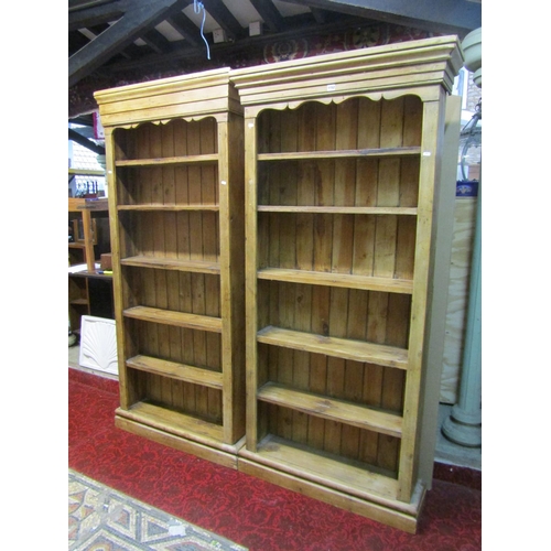 1152 - A matched pair of free-standing rustic pale pine bookcases, each 191cm high, 91 x 26cm