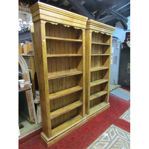 1152 - A matched pair of free-standing rustic pale pine bookcases, each 191cm high, 91 x 26cm