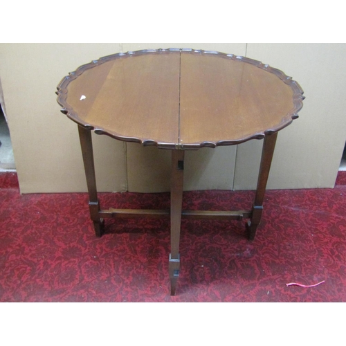 1404 - An unusual patent mahogany folding side table made by Charles Baker, Wells Road, Bath, the circular ... 