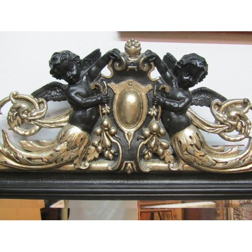 1406 - A large decorative arched wall mirror with figural surmount 173 x 103cm.