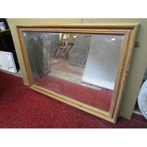 1427 - A large pine framed wall mirror, 98 x 138cm.