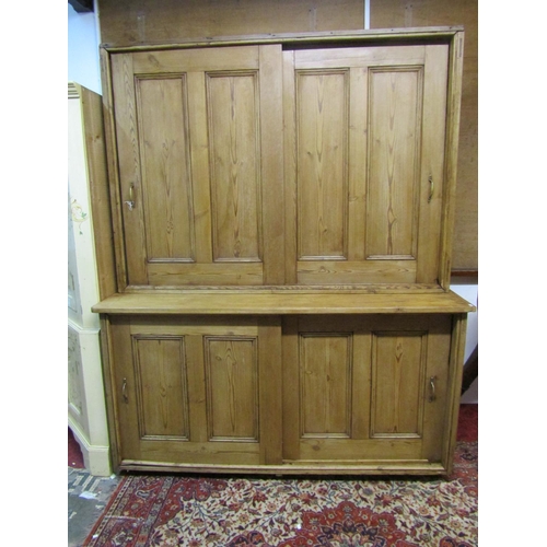 1430 - A large late Victorian rustic farmhouse pine housekeeper’s cupboard, with sliding doors opening to r... 