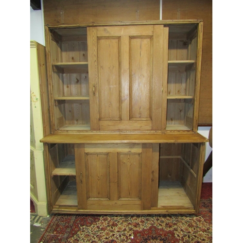 1430 - A large late Victorian rustic farmhouse pine housekeeper’s cupboard, with sliding doors opening to r... 