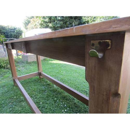 1237 - A pine hall table in the Cotswold School style, with chamfered squared legs united by stretchers, wi... 