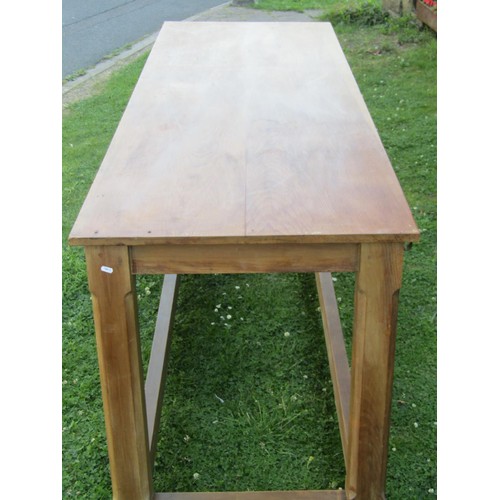 1237 - A pine hall table in the Cotswold School style, with chamfered squared legs united by stretchers, wi... 