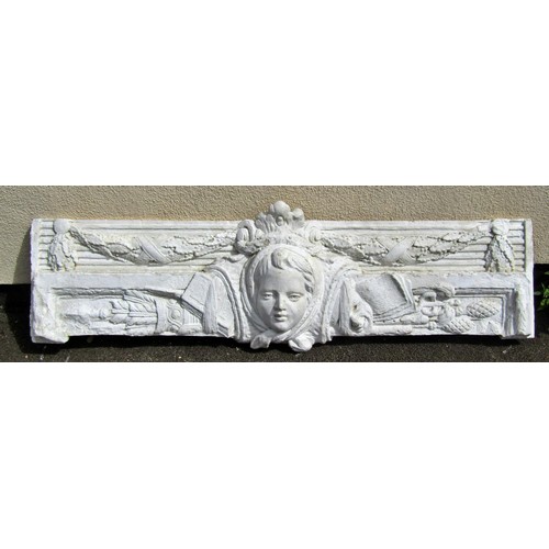 1597 - A large plaster panel / frieze, cantered with a maiden’s mask  flanked by garlands, 54 x 180cm