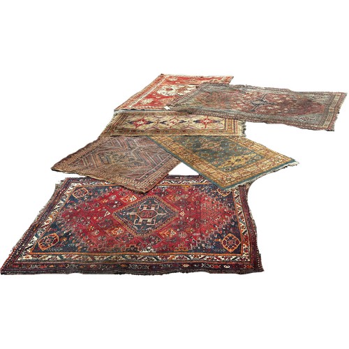 1746 - Six old worn and torn Middle Eastern carpets of varying designs sizes and condition all as found