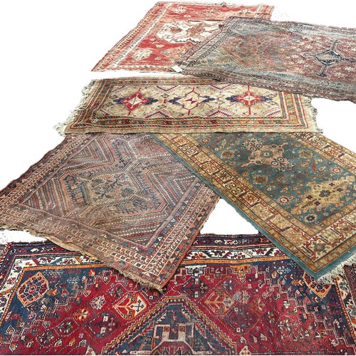 1746 - Six old worn and torn Middle Eastern carpets of varying designs sizes and condition all as found