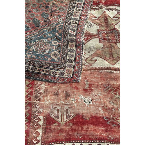 1746 - Six old worn and torn Middle Eastern carpets of varying designs sizes and condition all as found